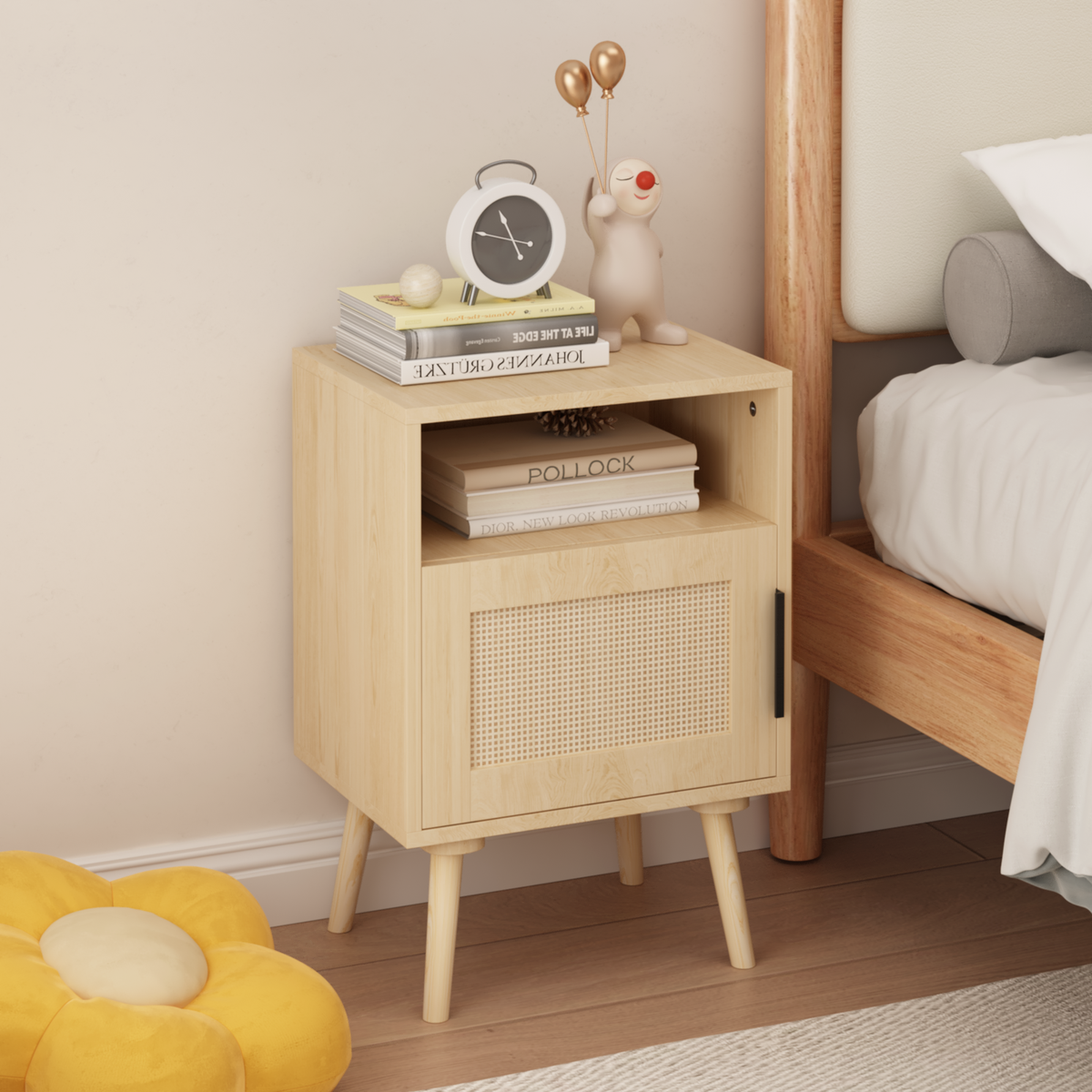 Wooden nightstand with decorative items next to a bed in a bedroom setting