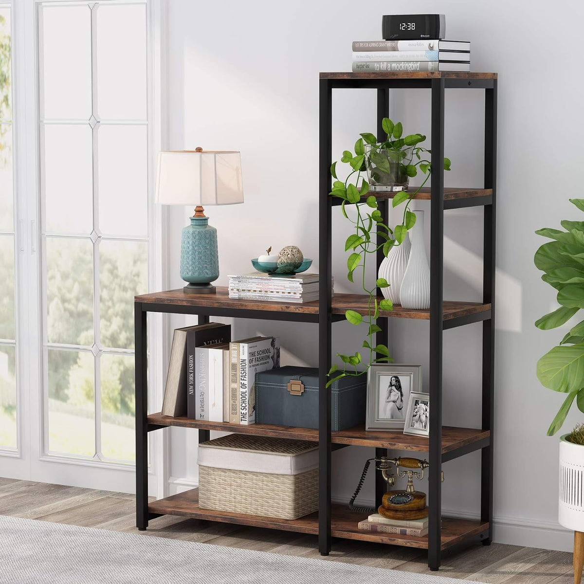 Wooden bookshelf with decorative items in a room with a window and plants.