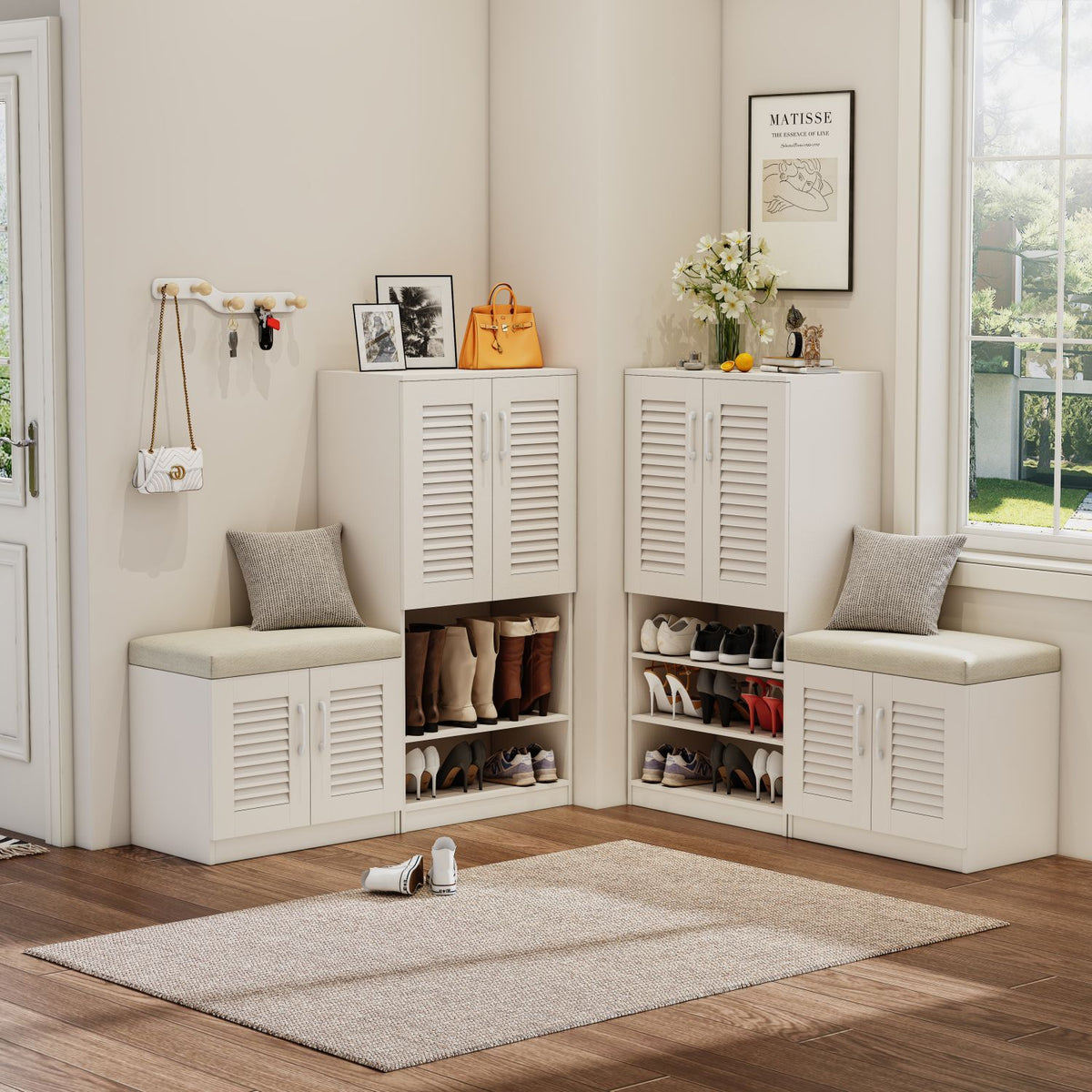 White shoe storage cabinets with benches in a room with a rug and decor items.