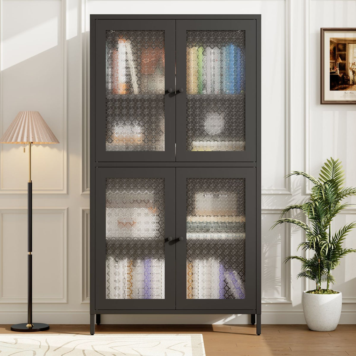 Dark glass-fronted cabinet in a room with a lamp and plant