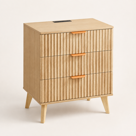 A mid-century modern wooden nightstand with three vertically fluted drawers, tapered legs, and orange handles, shown on a clean off-white background.