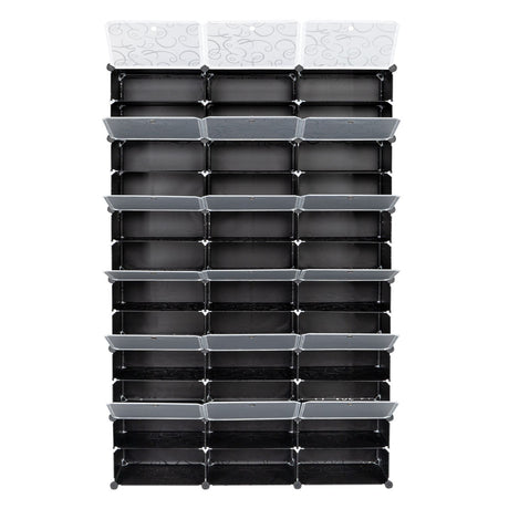 A black plastic organizer rack with multiple rectangular compartments and three white decorative hanging tabs at the top, shown against a plain white background.