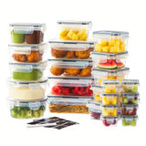 A set of clear plastic food storage containers with dark lids, shown filled with assorted fruits, vegetables, and pasta, alongside a small black-and-white marker on a white background.