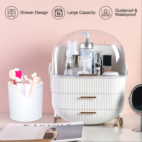 A white ribbed cosmetic organizer with a clear dome lid and three drawers, shown on a tabletop with beauty products inside. A matching white cup sits to the left, and a small round mirror is partially visible on the right.