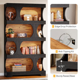 A tall black shelving unit with warm wood shelves and decorative objects, shown on a light neutral background with three inset detail callouts labeled Edge Drop Protection, Anti-Tipping Kit, and Sturdy Raised Base.