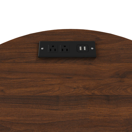 Wooden surface with a black electrical outlet and USB port.