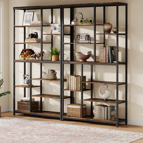 A tall, multi-compartment shelving unit with a black metal frame and rustic brown wooden shelves, styled with books, vases, a plant, and decorative items in a bright room.