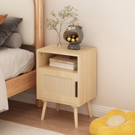 Wooden nightstand with decorative items next to a bed in a bedroom setting