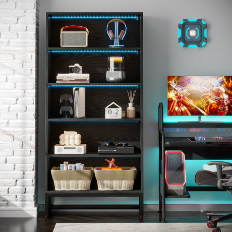 Black shelving unit with decorative items in a room with gaming setup and wall art.