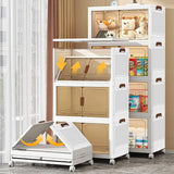 A white plastic storage organizer cabinet with multiple doors and transparent windows, shown in a room setting with toys and household items inside. One cabinet section is shown open at the bottom with yellow arrows indicating a folding or expanding function.