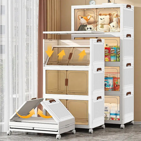 A white plastic storage organizer cabinet with multiple doors and transparent windows, shown in a room setting with toys and household items inside. One cabinet section is shown open at the bottom with yellow arrows indicating a folding or expanding function.