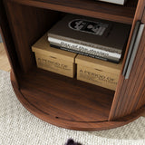 Wooden shelf with books and boxes on a carpeted floor
