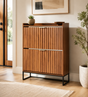 Mid-century walnut shoe cabinet with two fluted flip drawers and raised metal legs