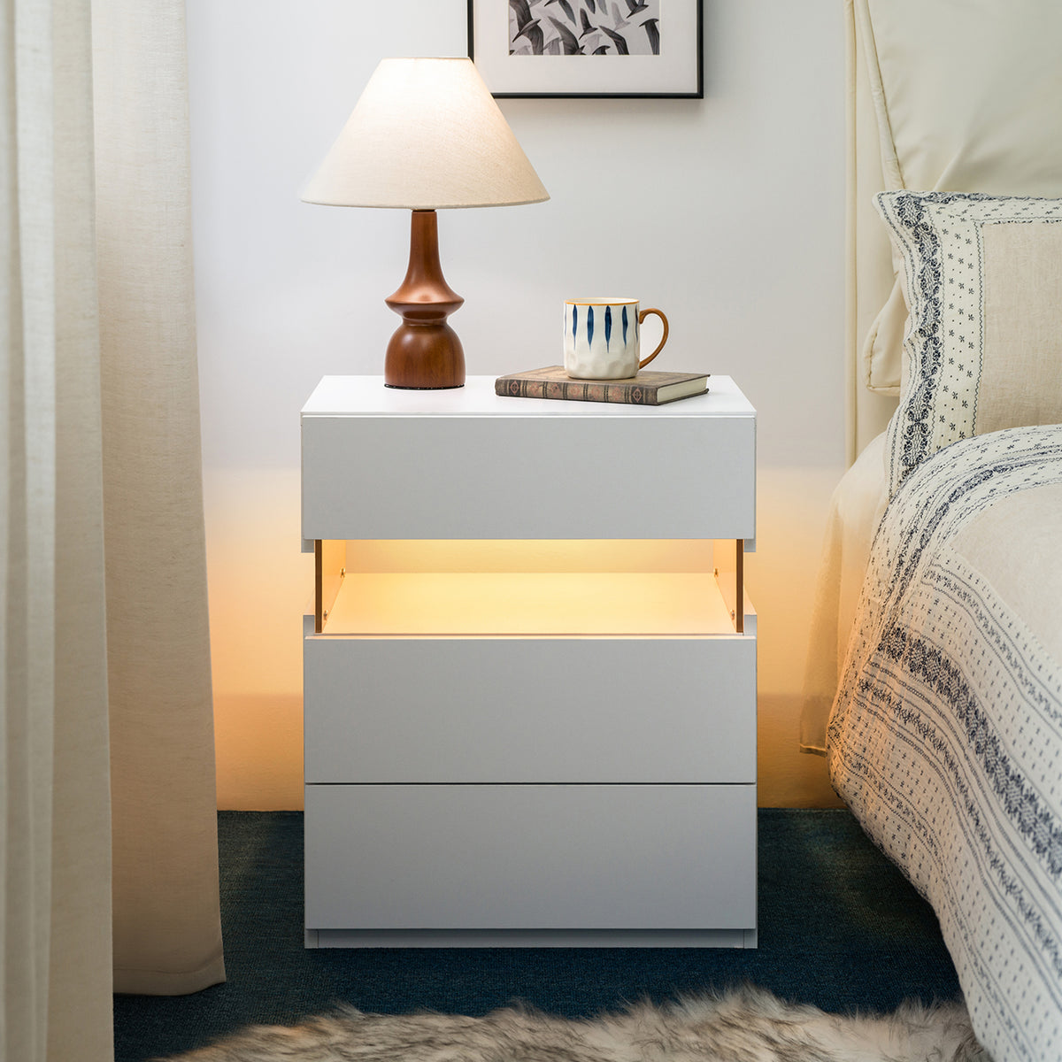 Modern white three-drawer nightstand with an illuminated acrylic panel and RGB LED lighting