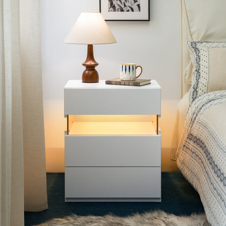 Modern white three-drawer nightstand with an illuminated acrylic panel and RGB LED lighting