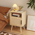 Oak-effect nightstand with a woven rattan-style door, open shelf and solid wood legs