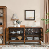Wooden sideboard with open doors displaying tableware in a living room setting.