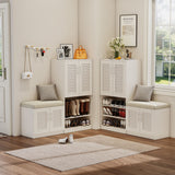 White shoe storage cabinets with benches in a room with a rug and decor items.