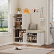 White shoe storage cabinet with open doors, shoes inside, and a cushioned bench on a wooden floor.