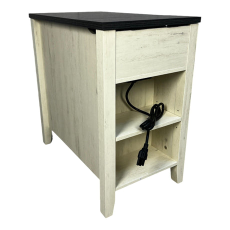 Wooden side table with black top and power cord inside, on a white background