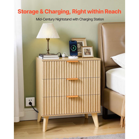 Wooden nightstand with charging station next to a bed in a bedroom setting.